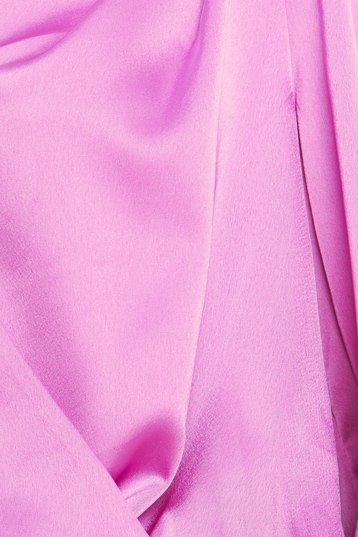 A solid woven top featuring surplice neckline, long sleeve with cuff and elasticized waist