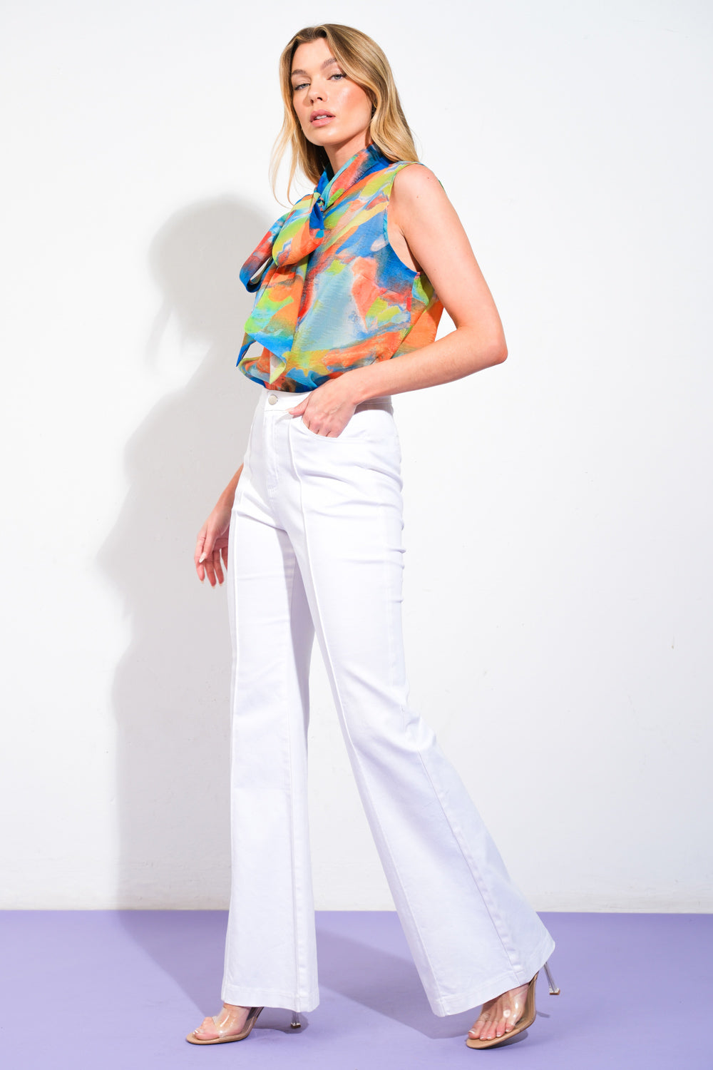 
A printed woven top featuring front bow tie, sleeveless and cami top. Matching pant IP8425

Details:

Self : 100% Polyester

Size &amp; Fit

- Model is 5`8" And Wearing Size Small
- Measurements Taken From Size Small
- Approx. Length: 23"