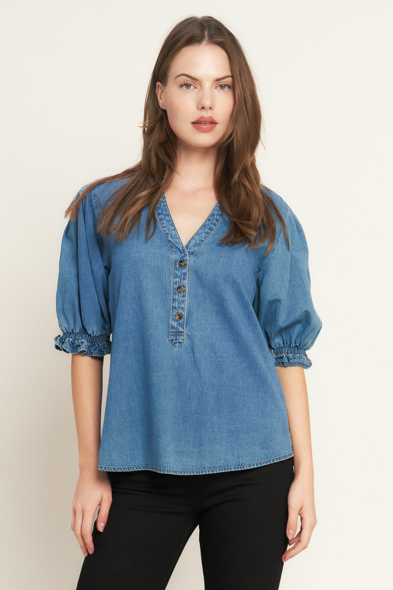 A washed denim shirt featuring V neckline, button down, front pocket and short sleeve