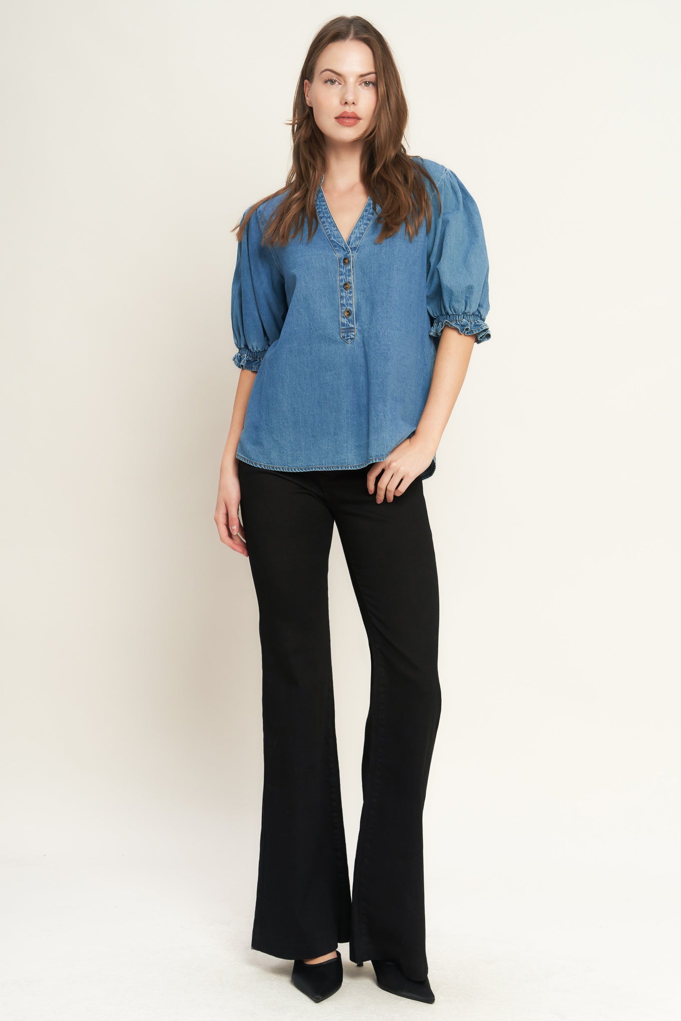 A washed denim shirt featuring V neckline, button down, front pocket and short sleeve