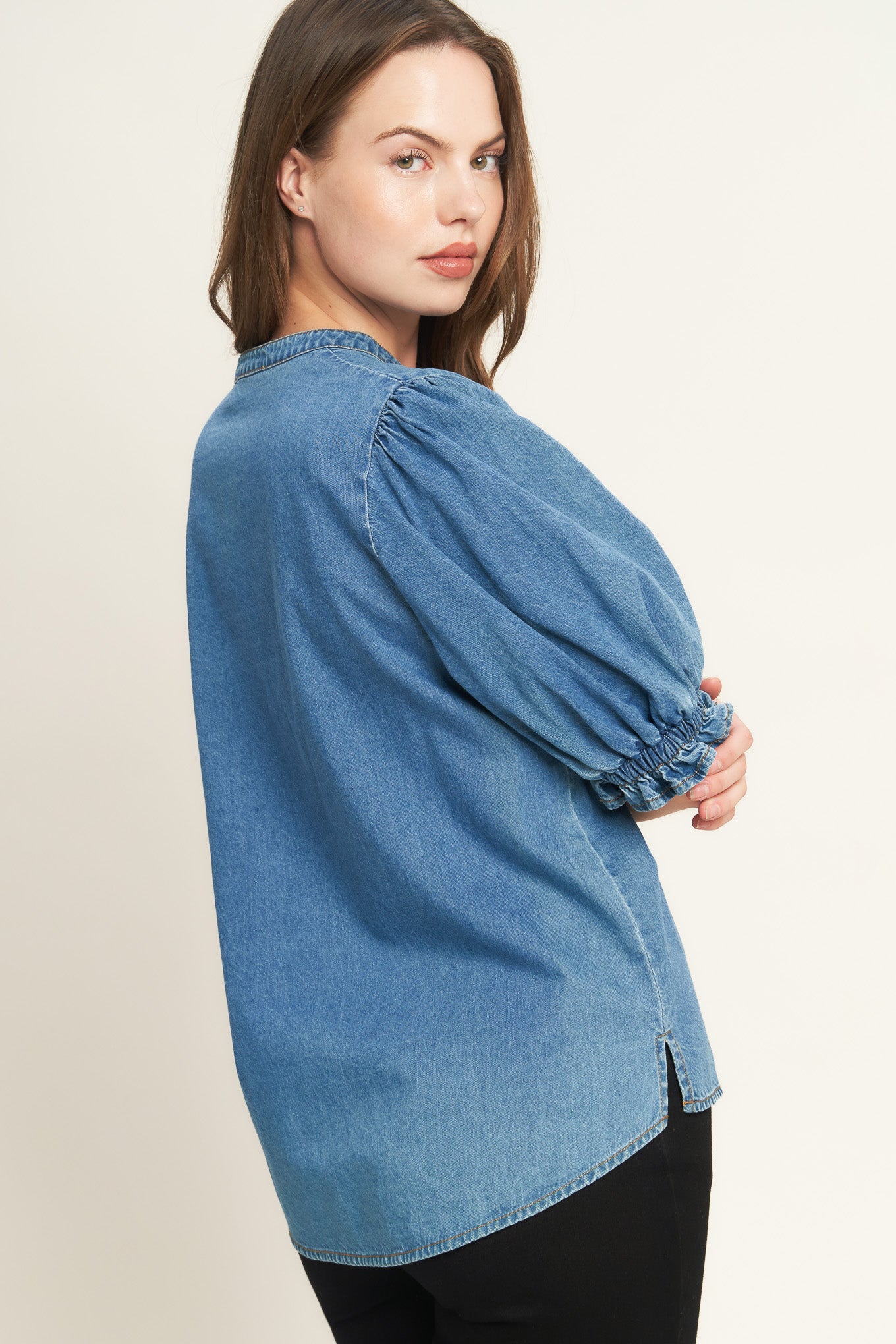 A washed denim shirt featuring V neckline, button down, front pocket and short sleeve