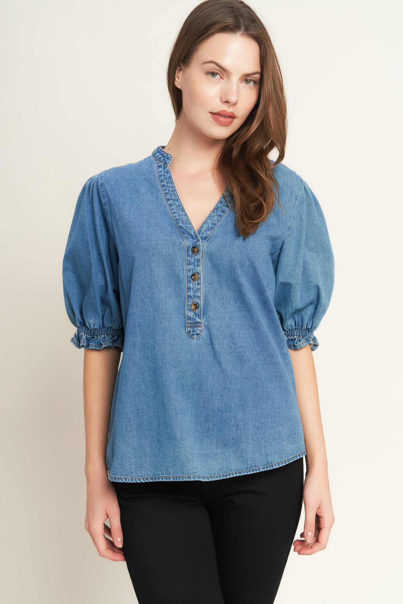 A washed denim shirt featuring V neckline, button down, front pocket and short sleeve