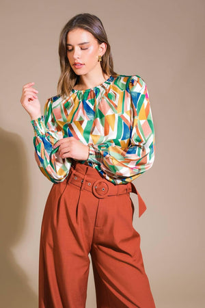 RADIANT POISE WOVEN TOP.