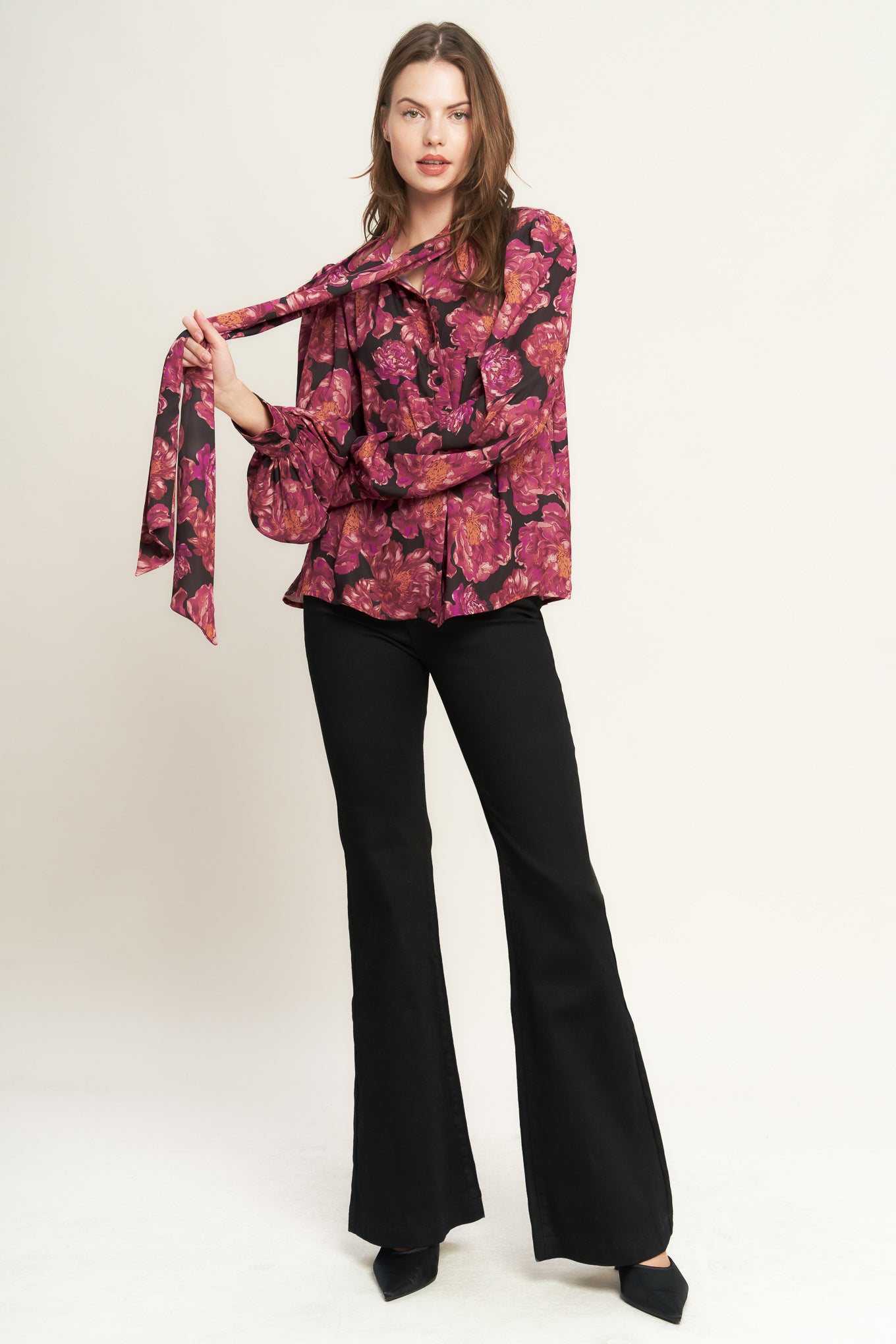 Woman wearing a pink floral blouse and black pants with a scarf on a white background - BEAUTIFUL EVENINGS WOVEN BLOUSE - FLYING TOMATO