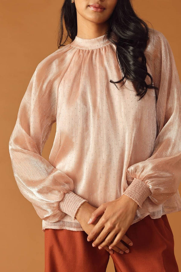 HIGHLY UNPREDICTABLE WOVEN TOP.