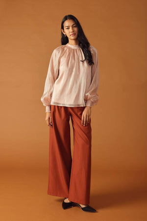 HIGHLY UNPREDICTABLE WOVEN TOP.