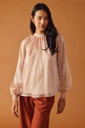 HIGHLY UNPREDICTABLE WOVEN TOP.