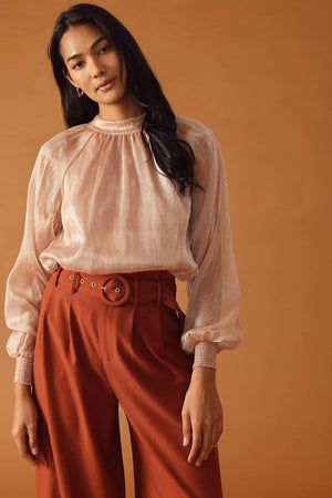 HIGHLY UNPREDICTABLE WOVEN TOP.