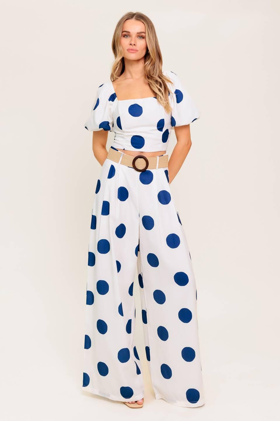 A printed top and pant set. Top featuring square neckline, short puff sleeve and smocked back bodice. Pant featuring side leg with side zipper closure.