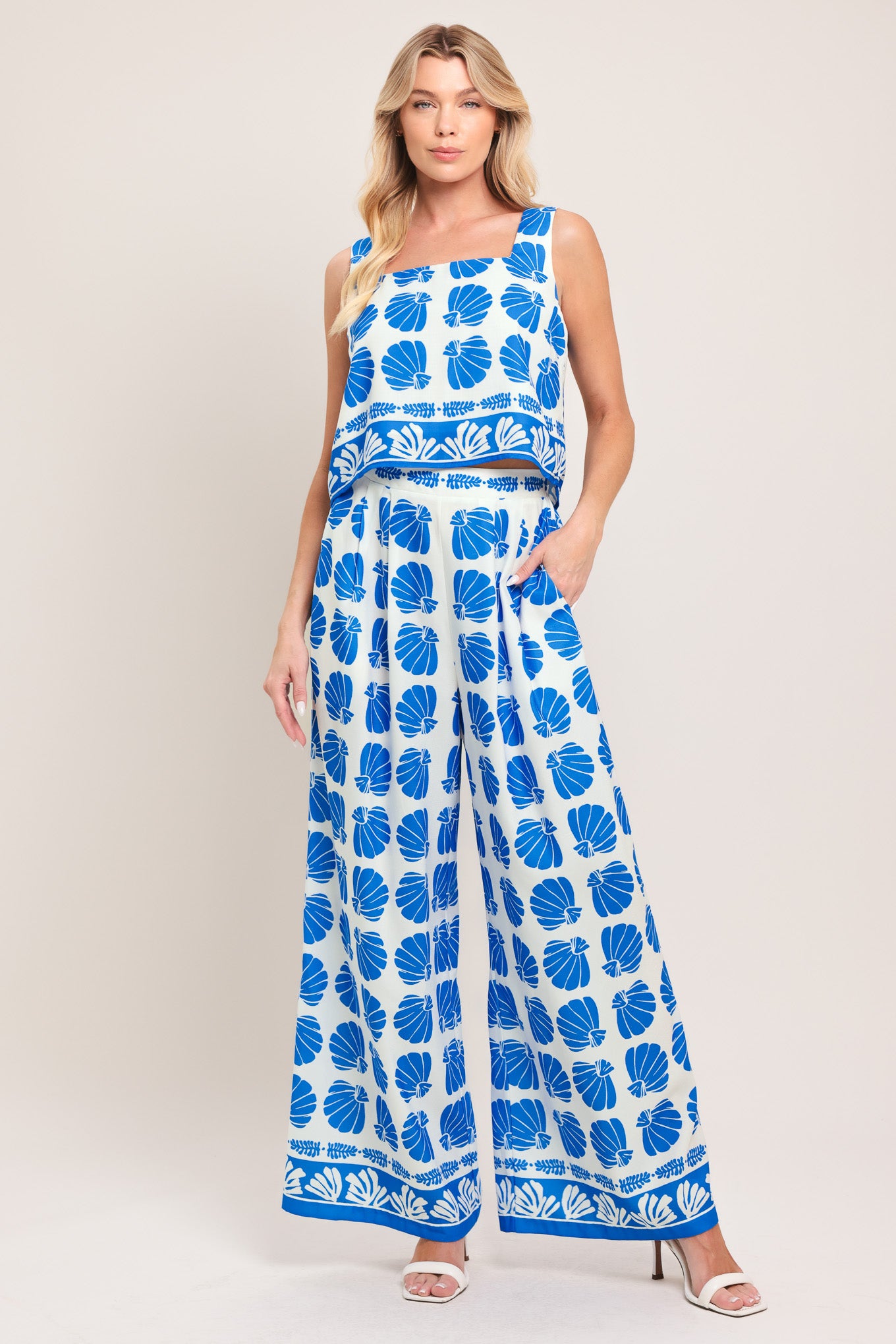 Woman wearing a blue and white patterned top and pant set | Flying Tomato