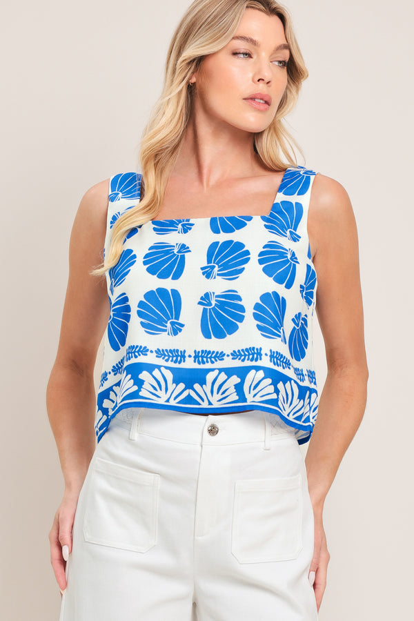Woman wearing a blue and white patterned top and pant set | Flying Tomato