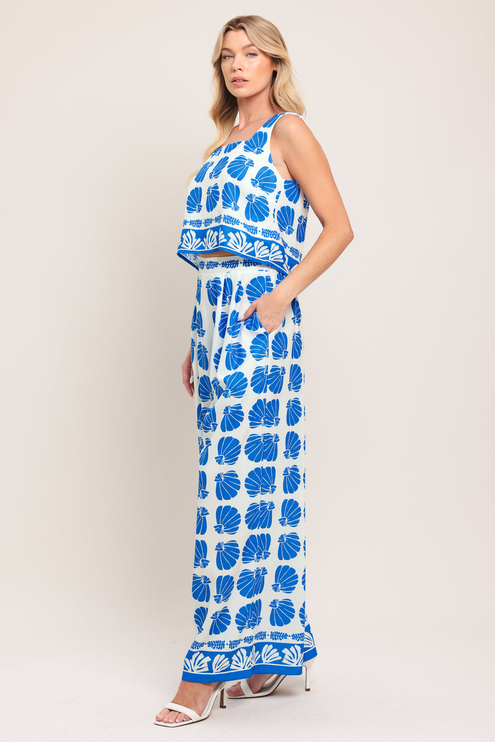 Woman wearing a blue and white patterned top and pant set | Flying Tomato