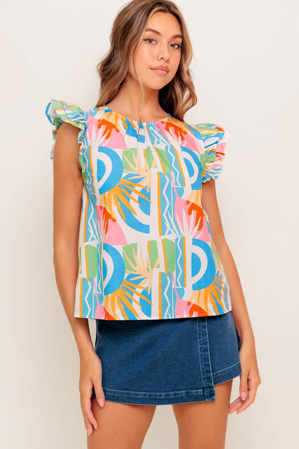 A printed woven top featuring round neckline, double ruffled sleeve and back keyhole button closure