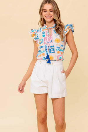 A printed woven top featuring ruffled neckline with front tie and double ruffled sleeve