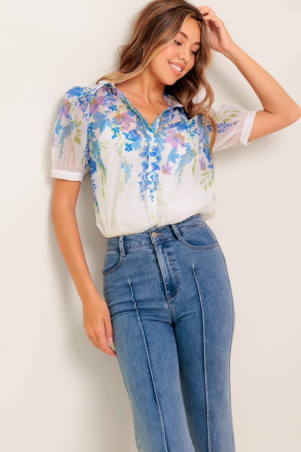 A printed woven top featuring collar, short sleeve, button down and cami.