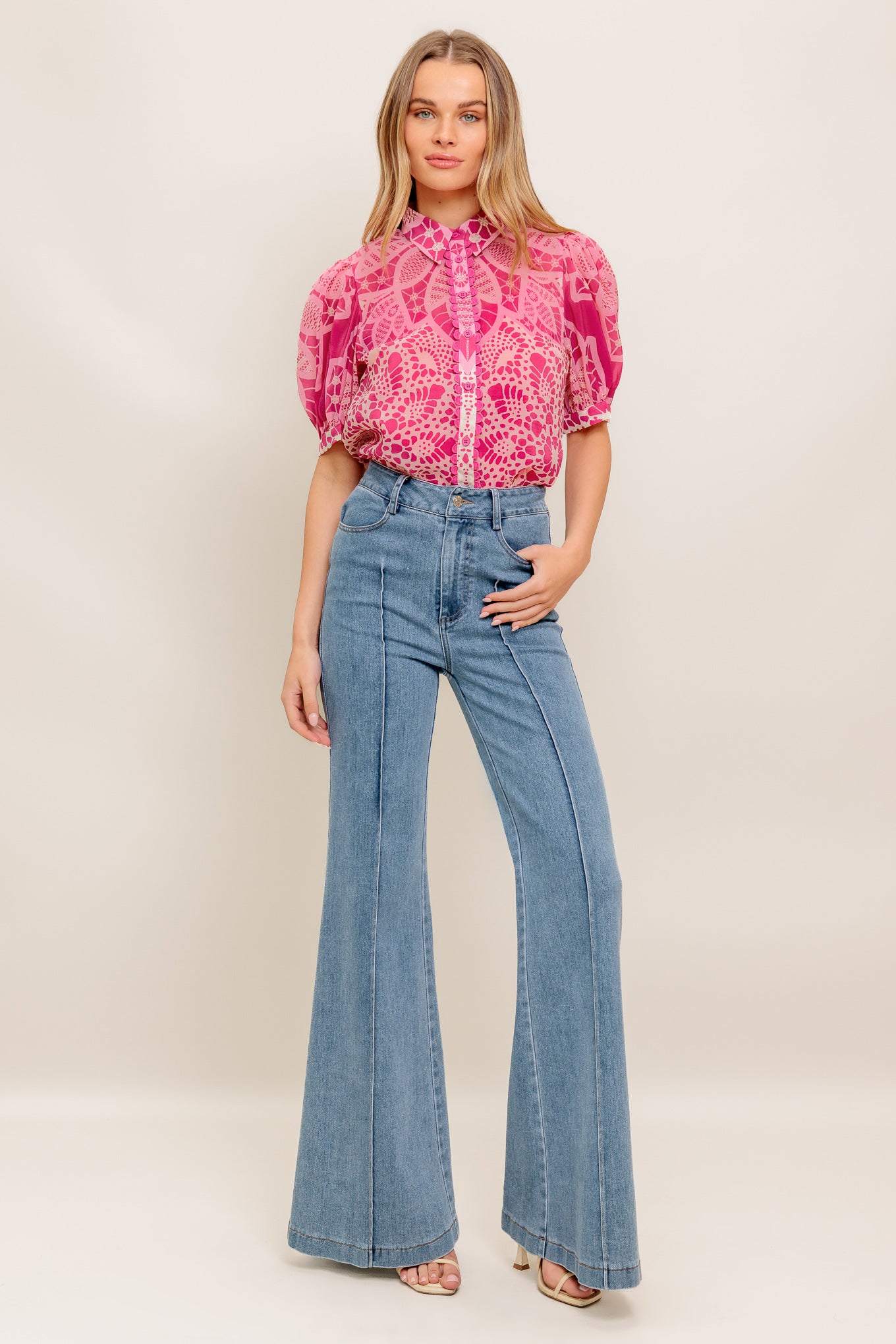 A printed woven top featuring collar, button down, short puff sleeve and cami