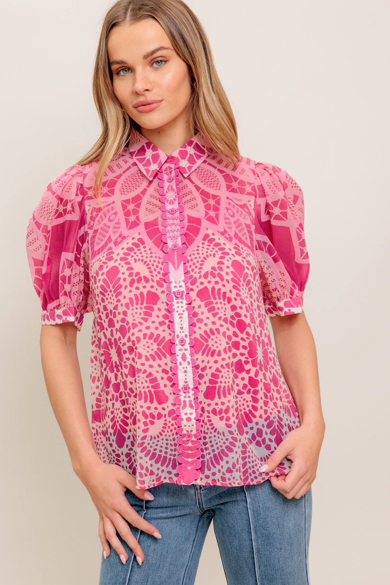 A printed woven top featuring collar, button down, short puff sleeve and cami