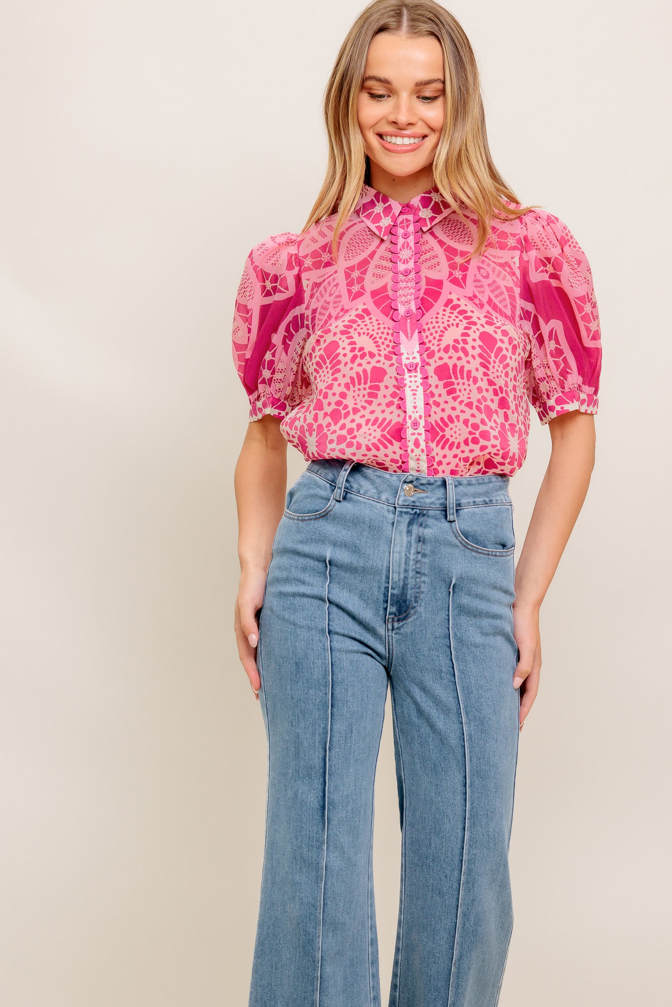 A printed woven top featuring collar, button down, short puff sleeve and cami