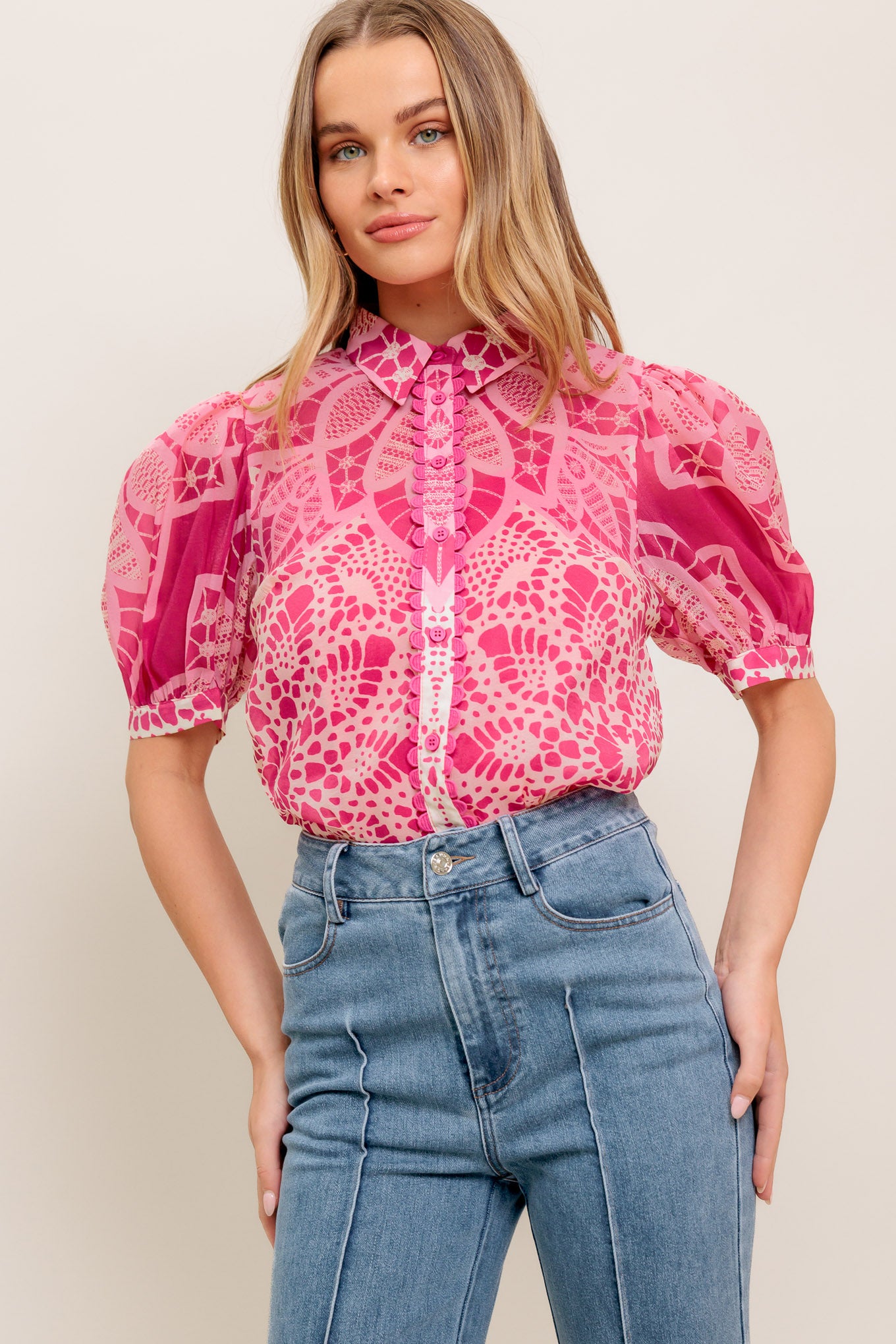 A printed woven top featuring collar, button down, short puff sleeve and cami