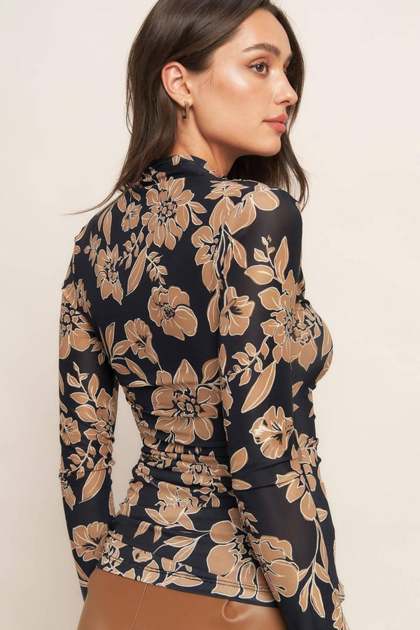 A printed power mesh top with high neckline and long sleeve