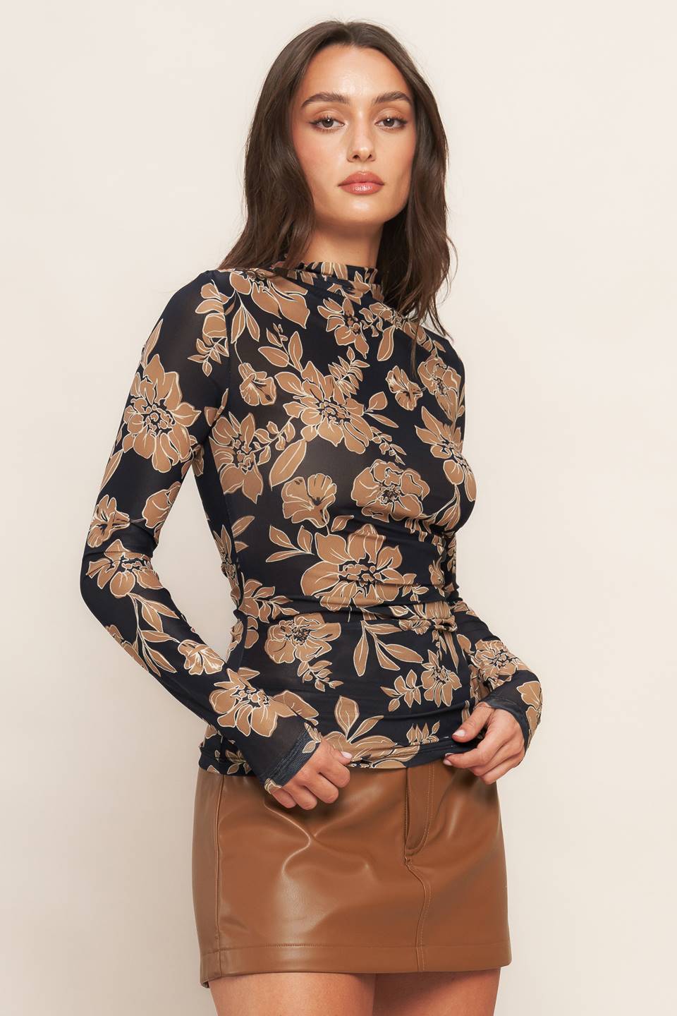 A printed power mesh top with high neckline and long sleeve