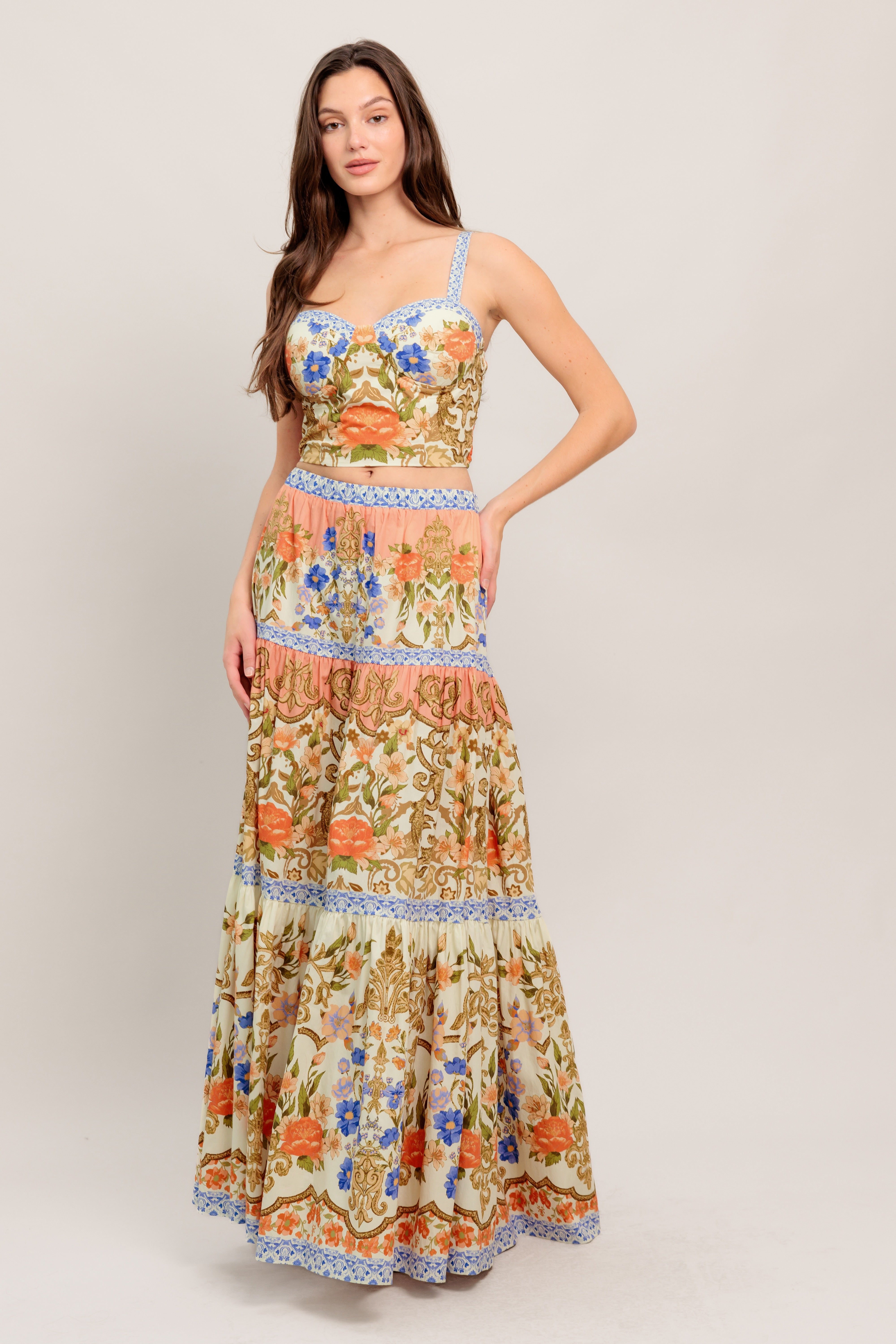 Floral two-piece set featuring a fitted bustier top and a flowing tiered maxi skirt

Details:

Self: 100% Cotton
Lining: 100% Polyester

Size & Fit

- Model is 5`8" And Wearing Size Small
- Measurements Taken From Size Small
- Approx. Length: 17" Top
- Approx. Length: 43" Bottom