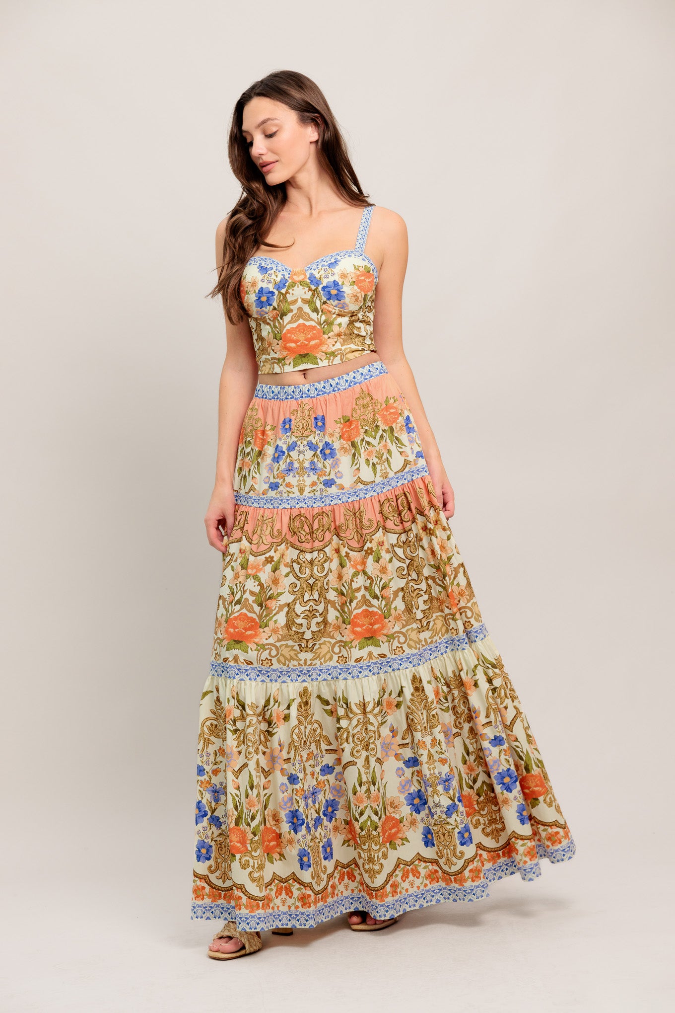 A printed woven bustier top and tiered maxi skirt set

Details:

Self: 100% Cotton
Lining: 100% Polyester

Size & Fit

- Model is 5`8" And Wearing Size Small
- Measurements Taken From Size Small
- Approx. Length: 17" Top
- Approx. Length: 43" Bottom