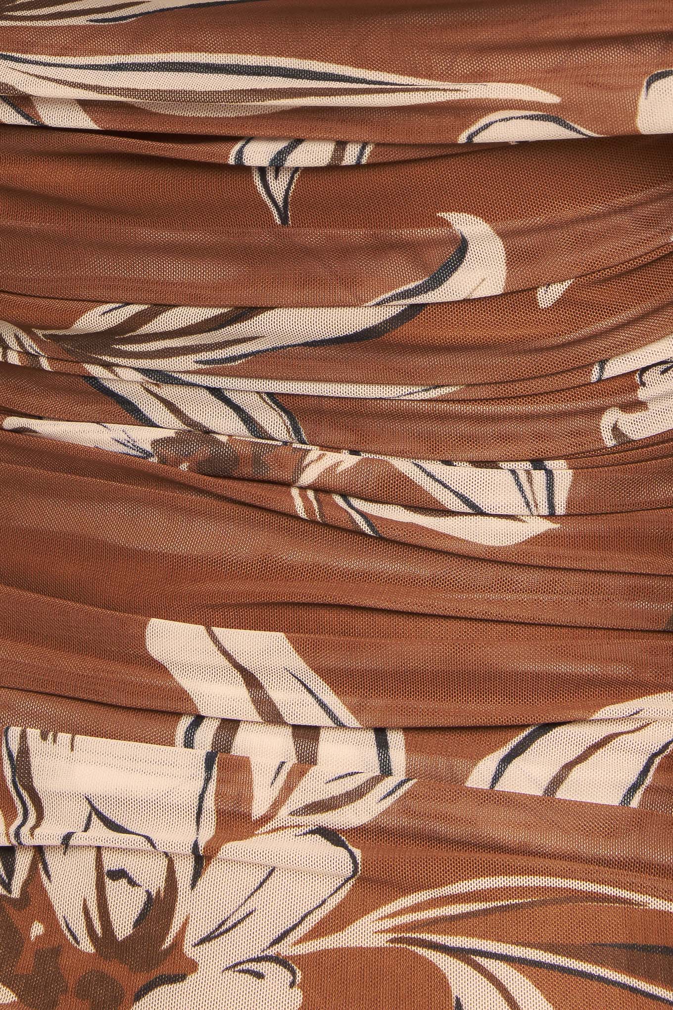 A printed power mesh top featuring off shoulder neckline, long sleeve and side shirring
