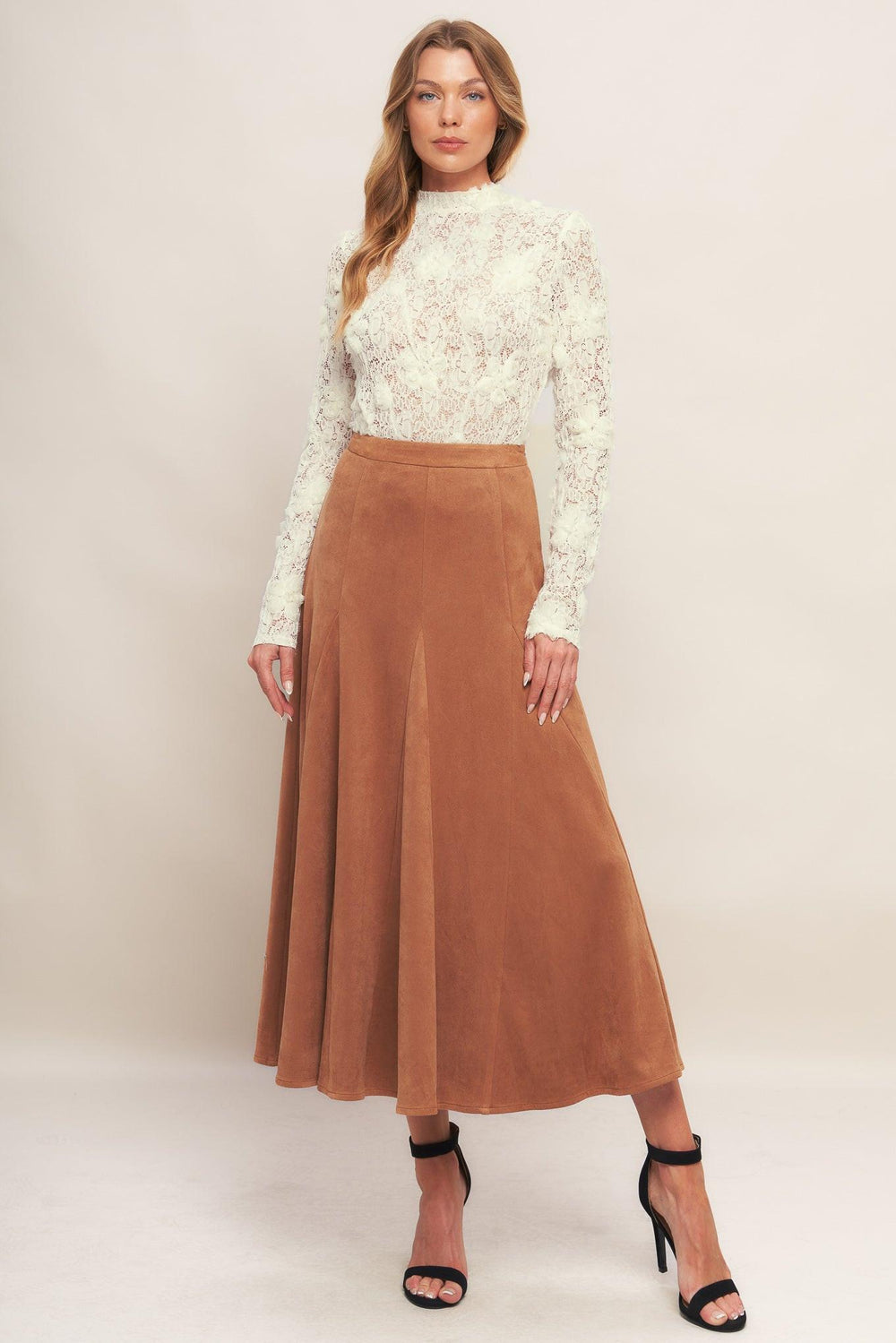 A textured light weight sweater top with mock neckline and back neck button closure