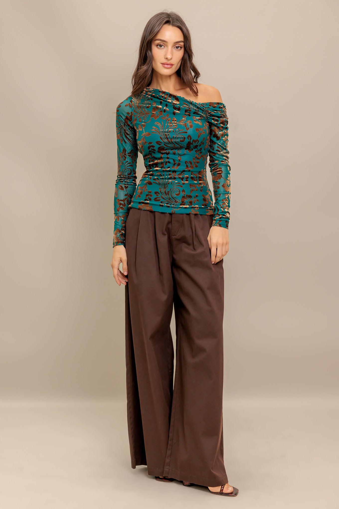 A flocked knit to featuring one side off shoulder and long sleeve