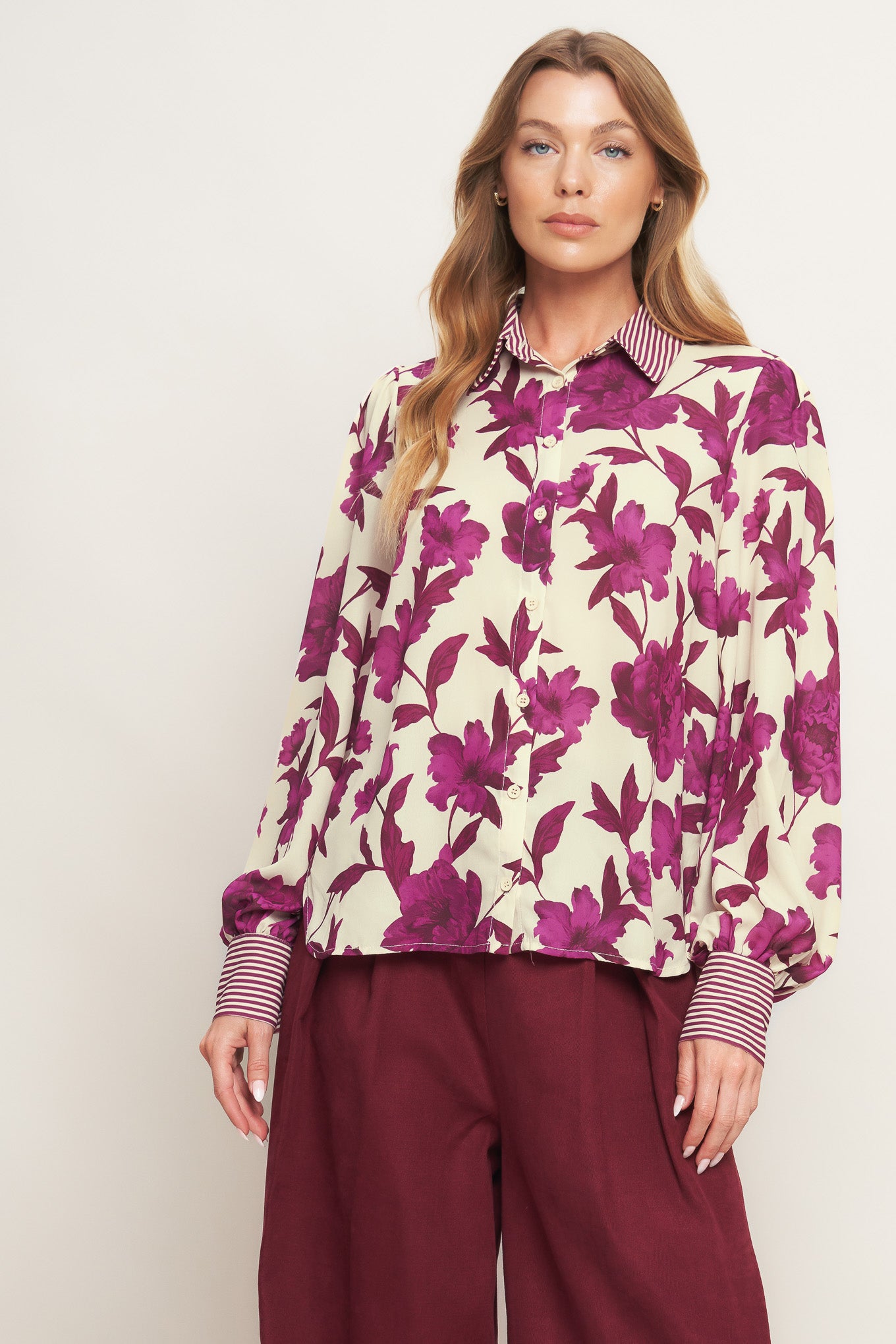A printed woven top with collar, button down and long sleeve