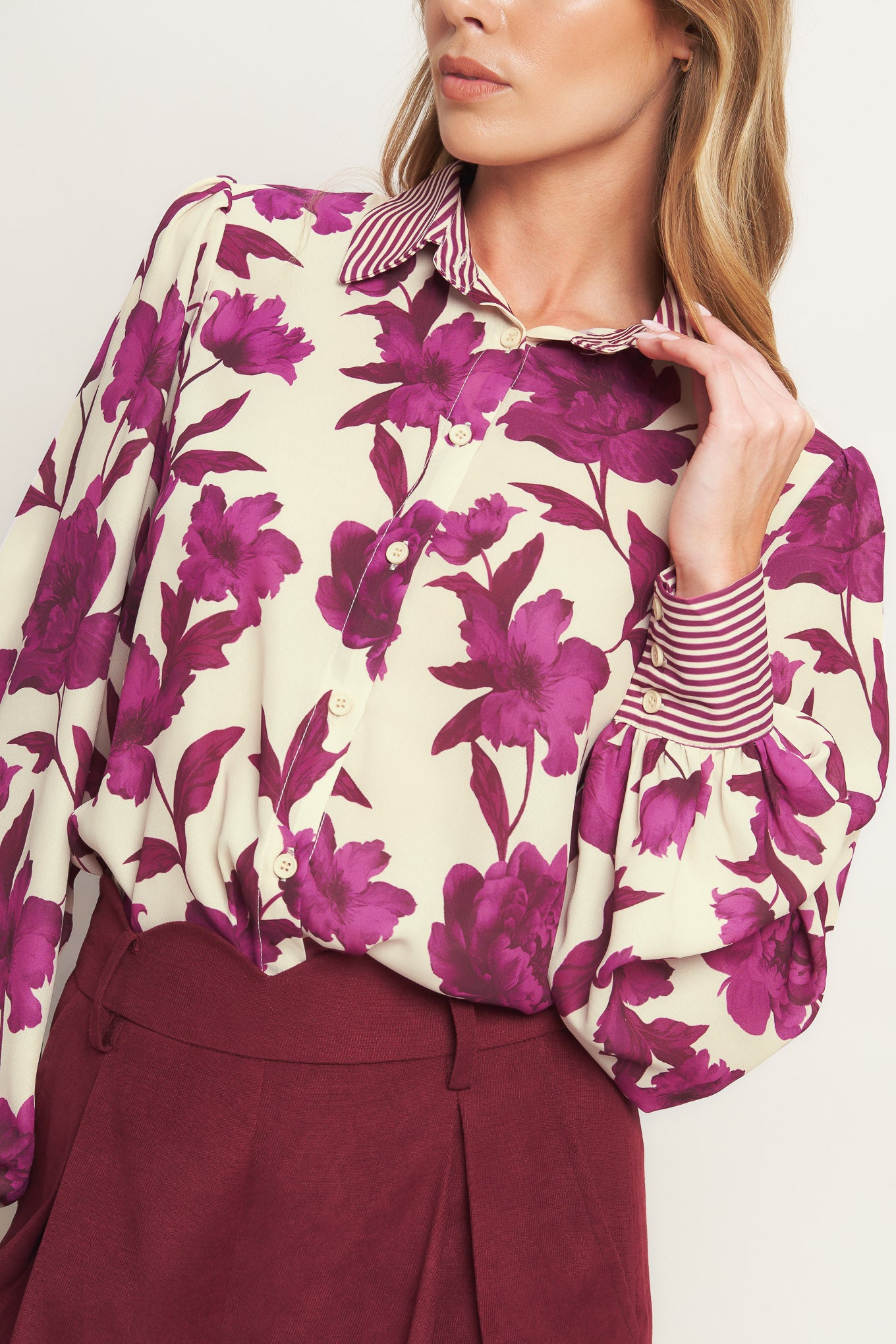 A printed woven top with collar, button down and long sleeve