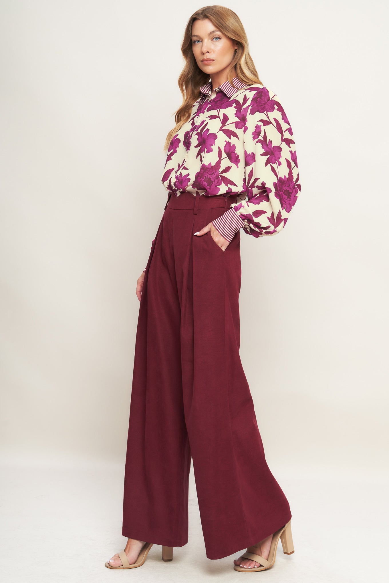A printed woven top with collar, button down and long sleeve