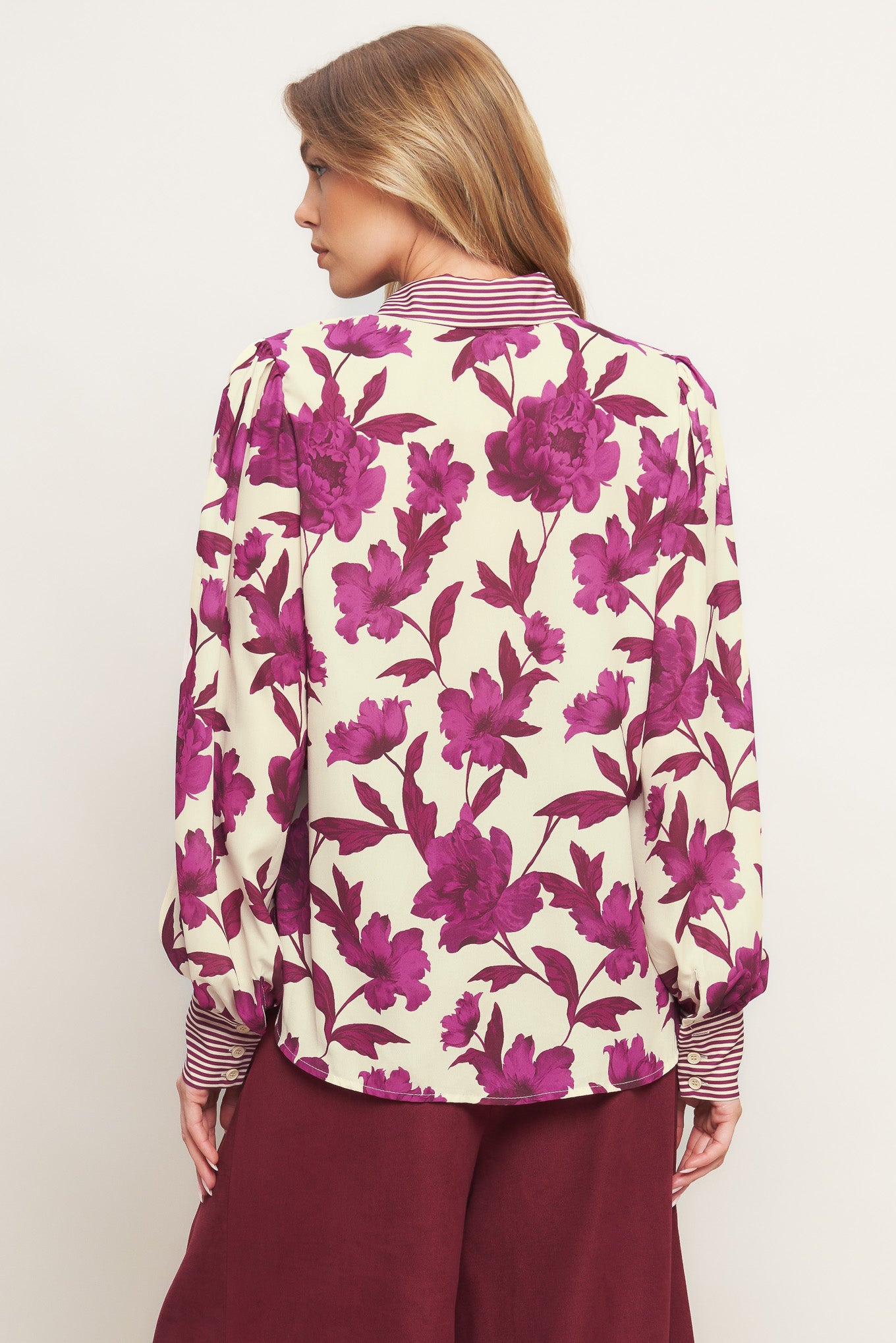 A printed woven top with collar, button down and long sleeve