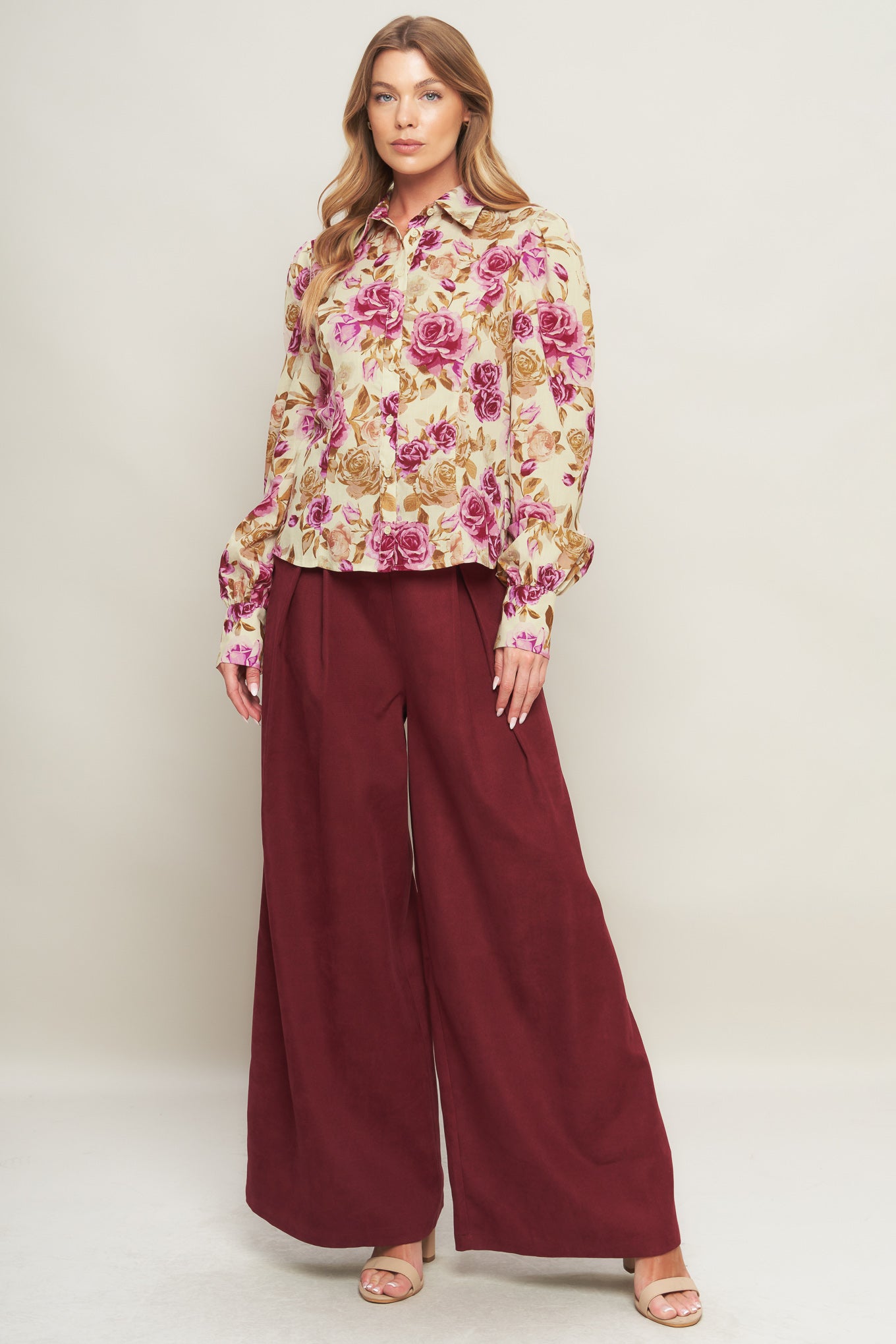 A printed woven top featuring collar, long sleeve and button down