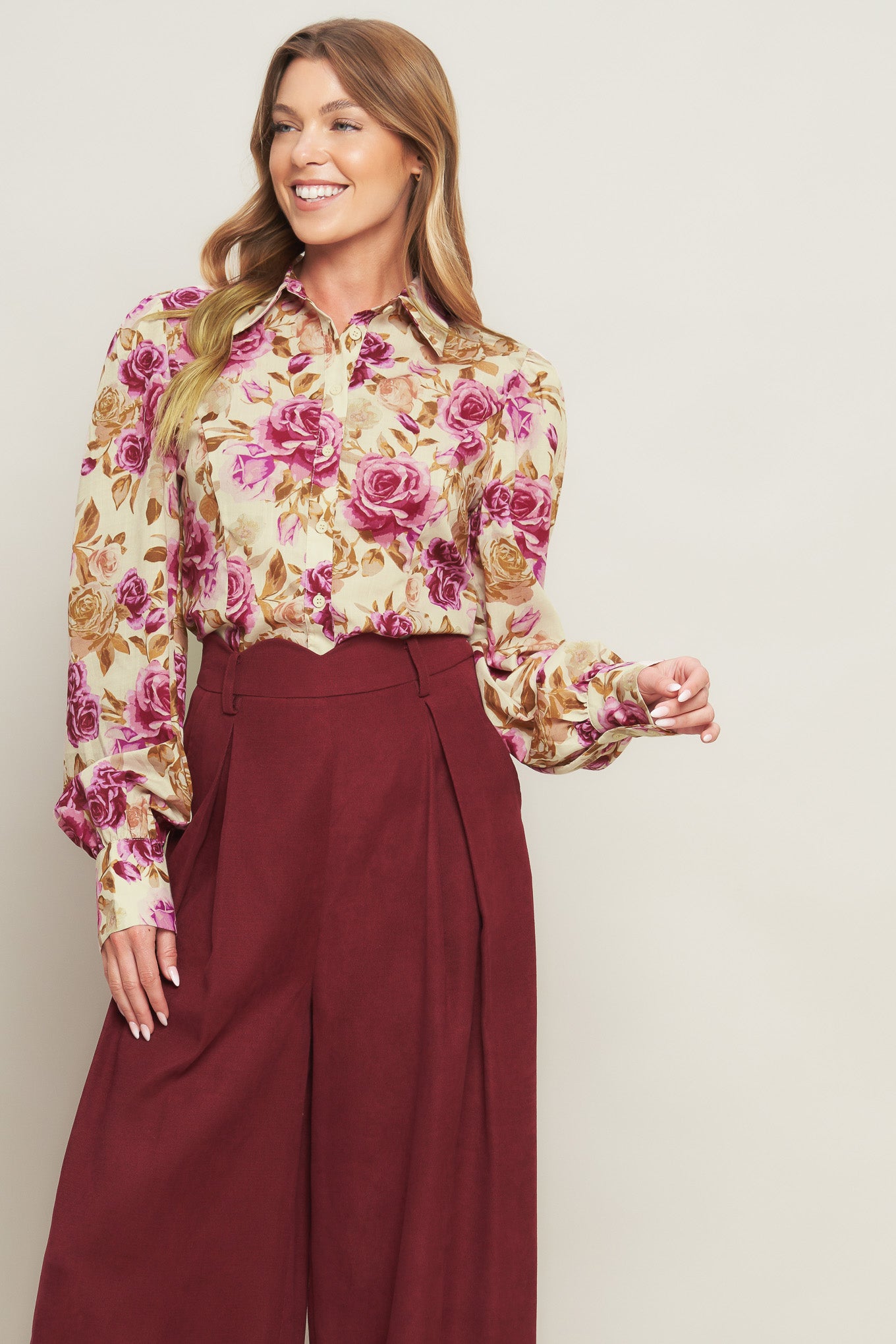 A printed woven top featuring collar, long sleeve and button down