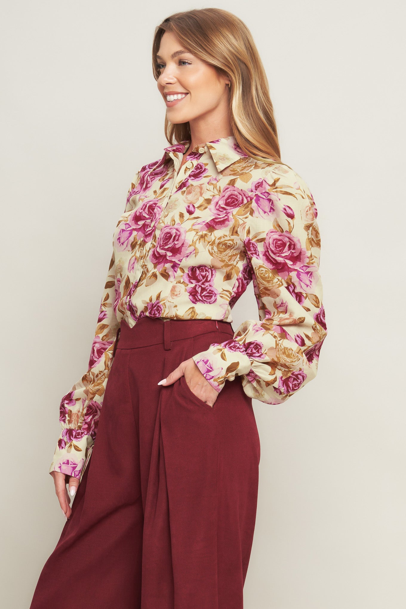 A printed woven top featuring collar, long sleeve and button down