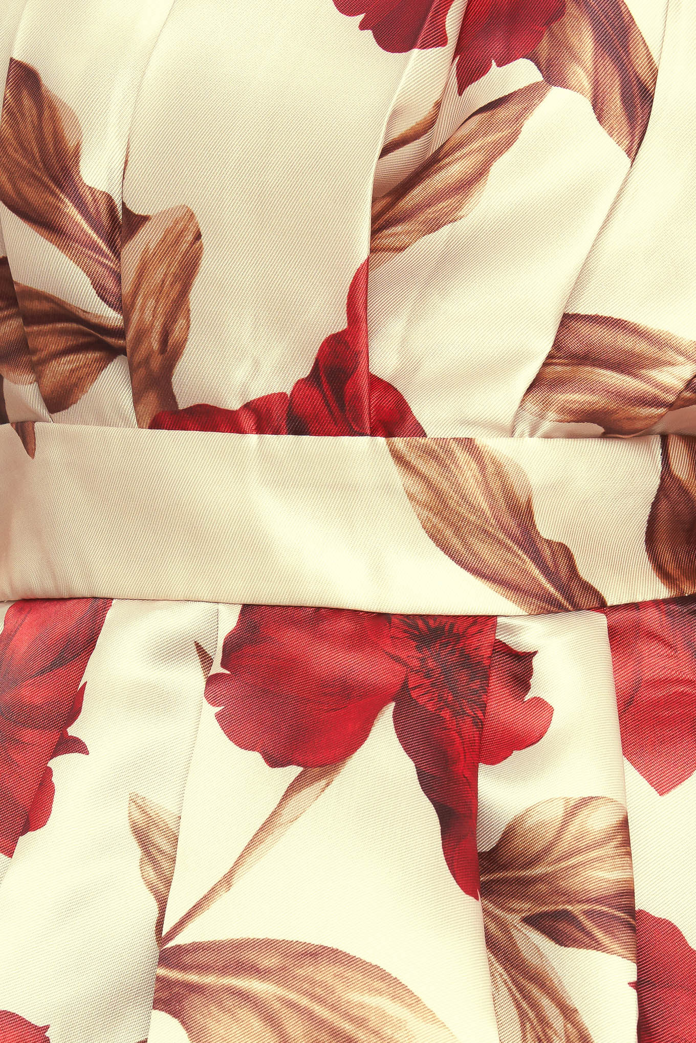 A printed woven top featuring strapless neckline, pleated body, peplum and smocked back bodice. 