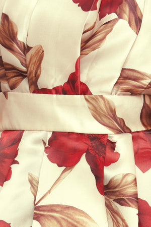 A printed woven top featuring strapless neckline, pleated body, peplum and smocked back bodice. 