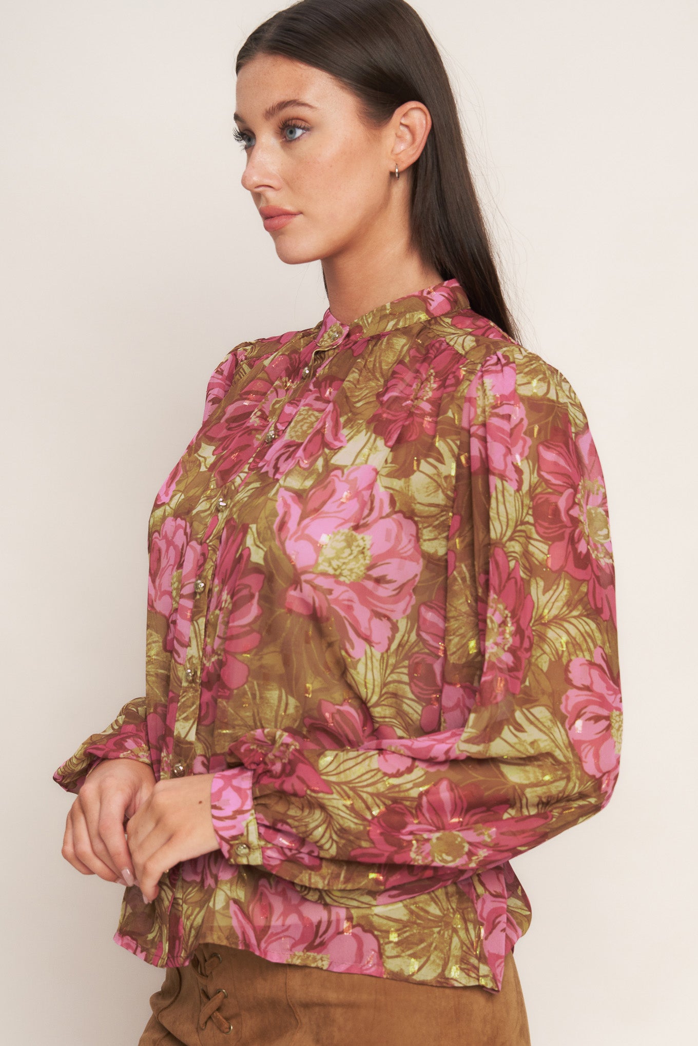 A printed woven top featuring china collar, long sleeve, front button down