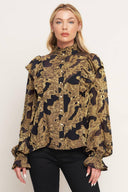 A jacquard woven top featuring high ruffled neckline, front button down, ruffle over shoulder and long sleeve with ruffled cuff