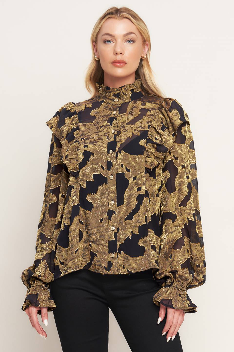 A jacquard woven top featuring high ruffled neckline, front button down, ruffle over shoulder and long sleeve with ruffled cuff