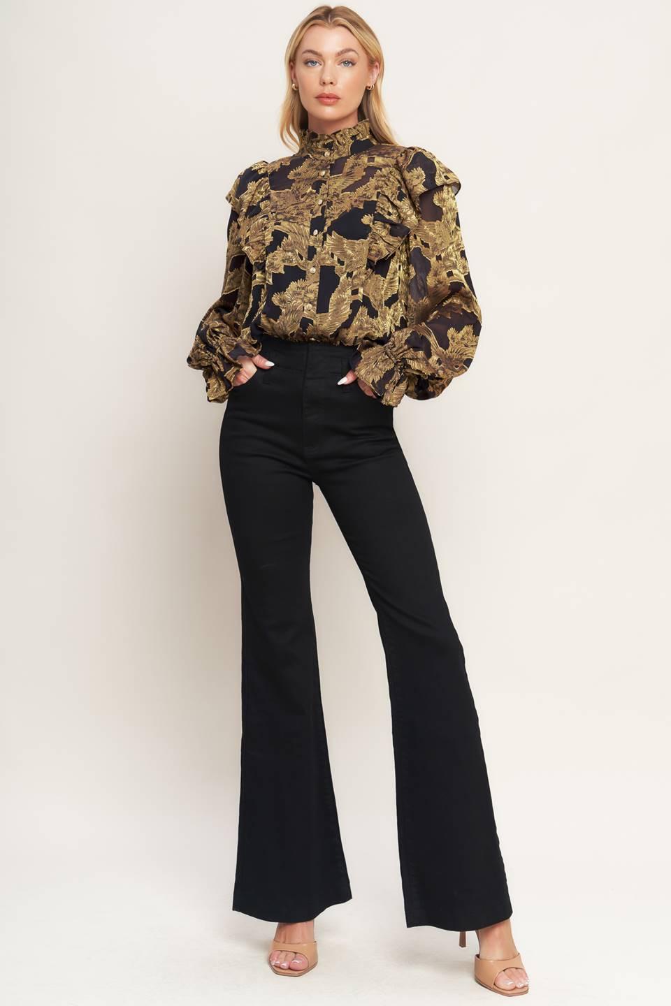A jacquard woven top featuring high ruffled neckline, front button down, ruffle over shoulder and long sleeve with ruffled cuff