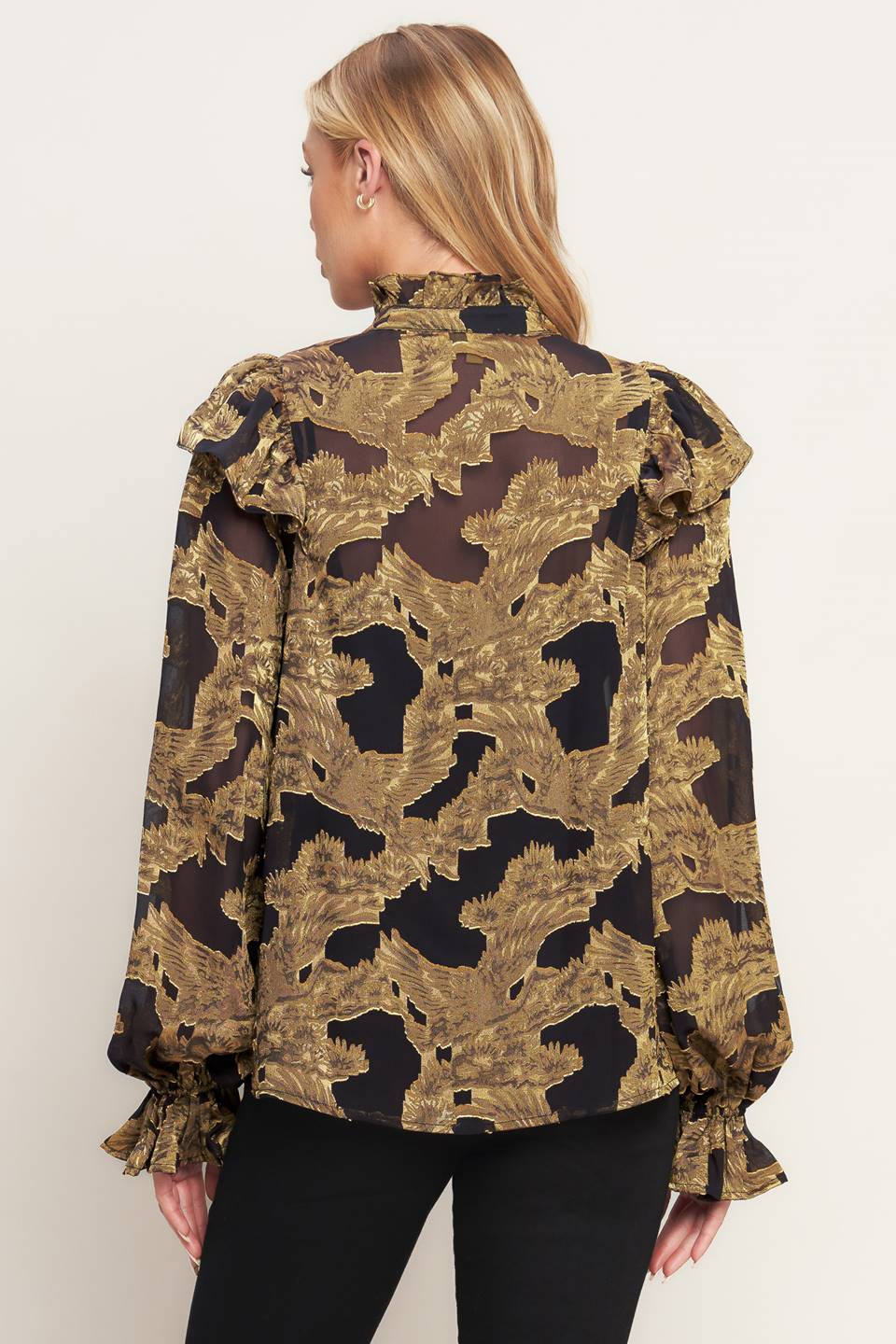 A jacquard woven top featuring high ruffled neckline, front button down, ruffle over shoulder and long sleeve with ruffled cuff