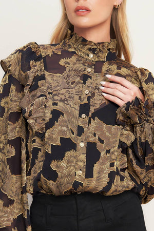 A jacquard woven top featuring high ruffled neckline, front button down, ruffle over shoulder and long sleeve with ruffled cuff
