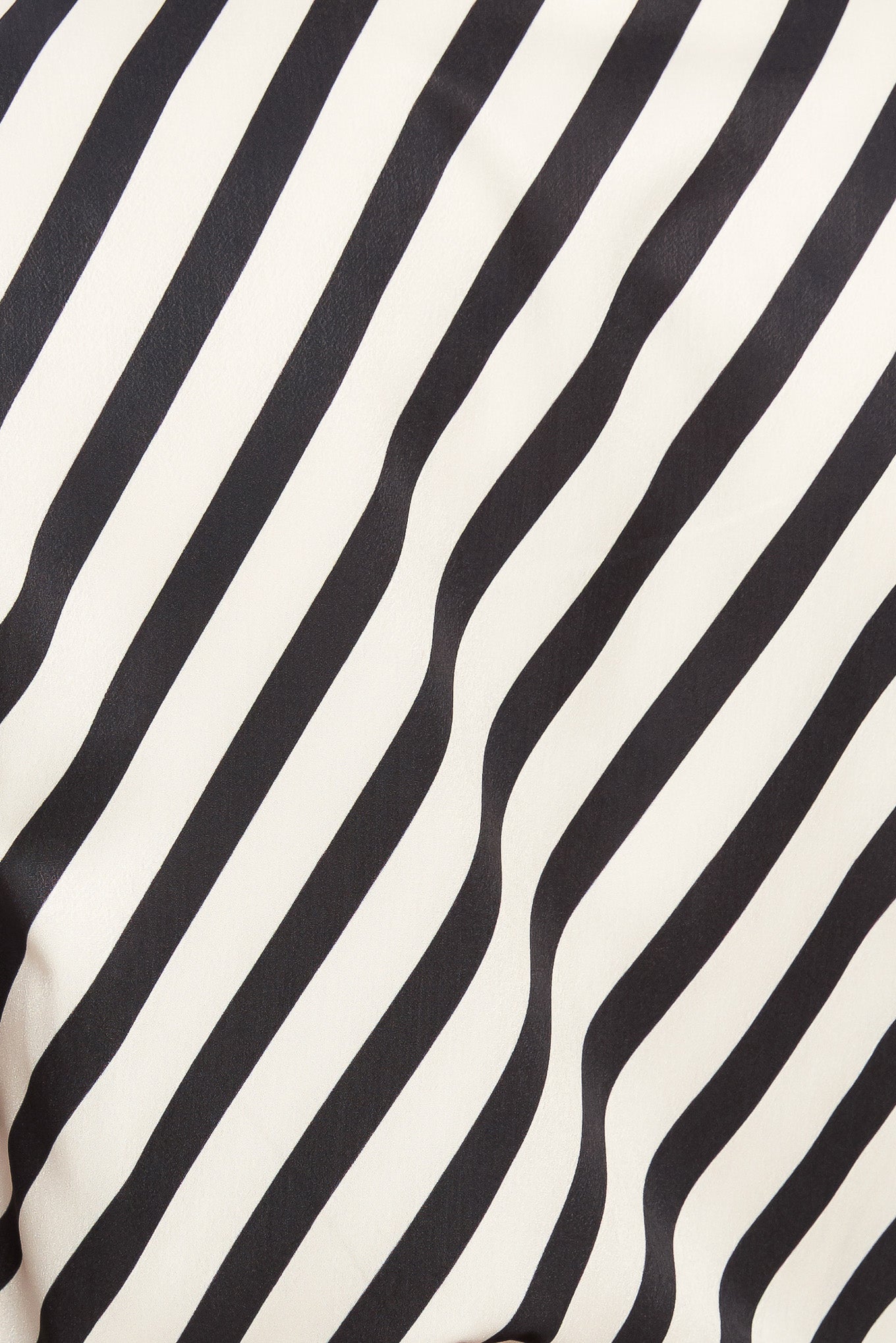 A striped woven top featuring high neckline with front bow tie and long sleeve with cuff
