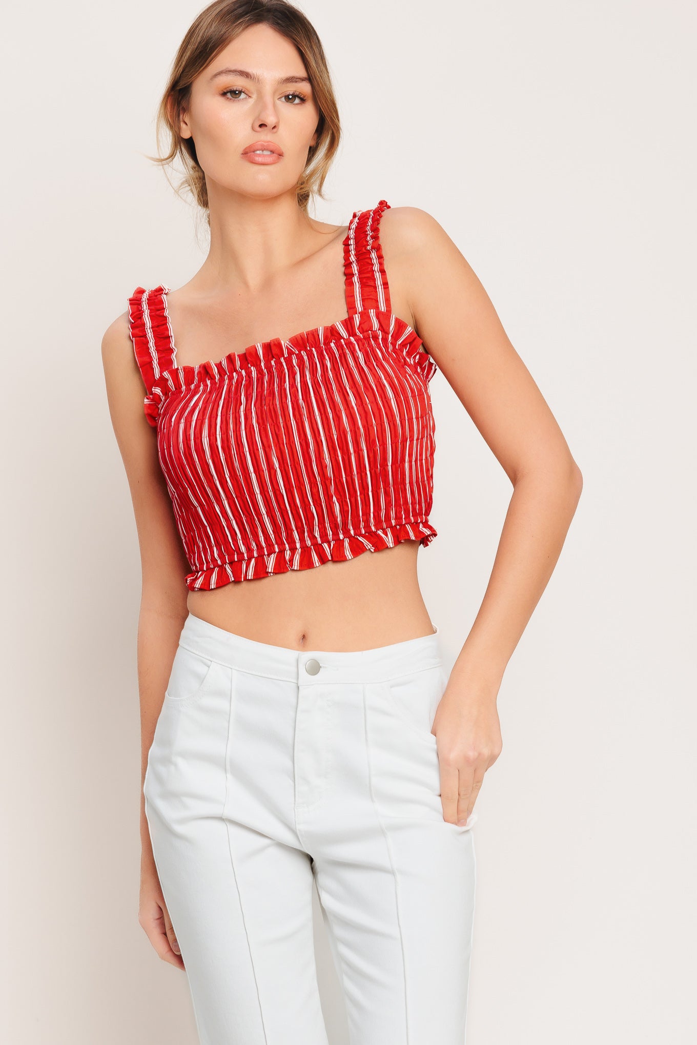 A striped woven top featuring straight ruffled neckline, straps and smocked bodice. Matching skirt IK7744T

Details:

Self: 100% Cotton

Lining: 100% Polyester

Size & Fit

-Model is 5`8" And Wearing Size Small
-Measurements Taken From Size Small
-Approx. Length: 17"