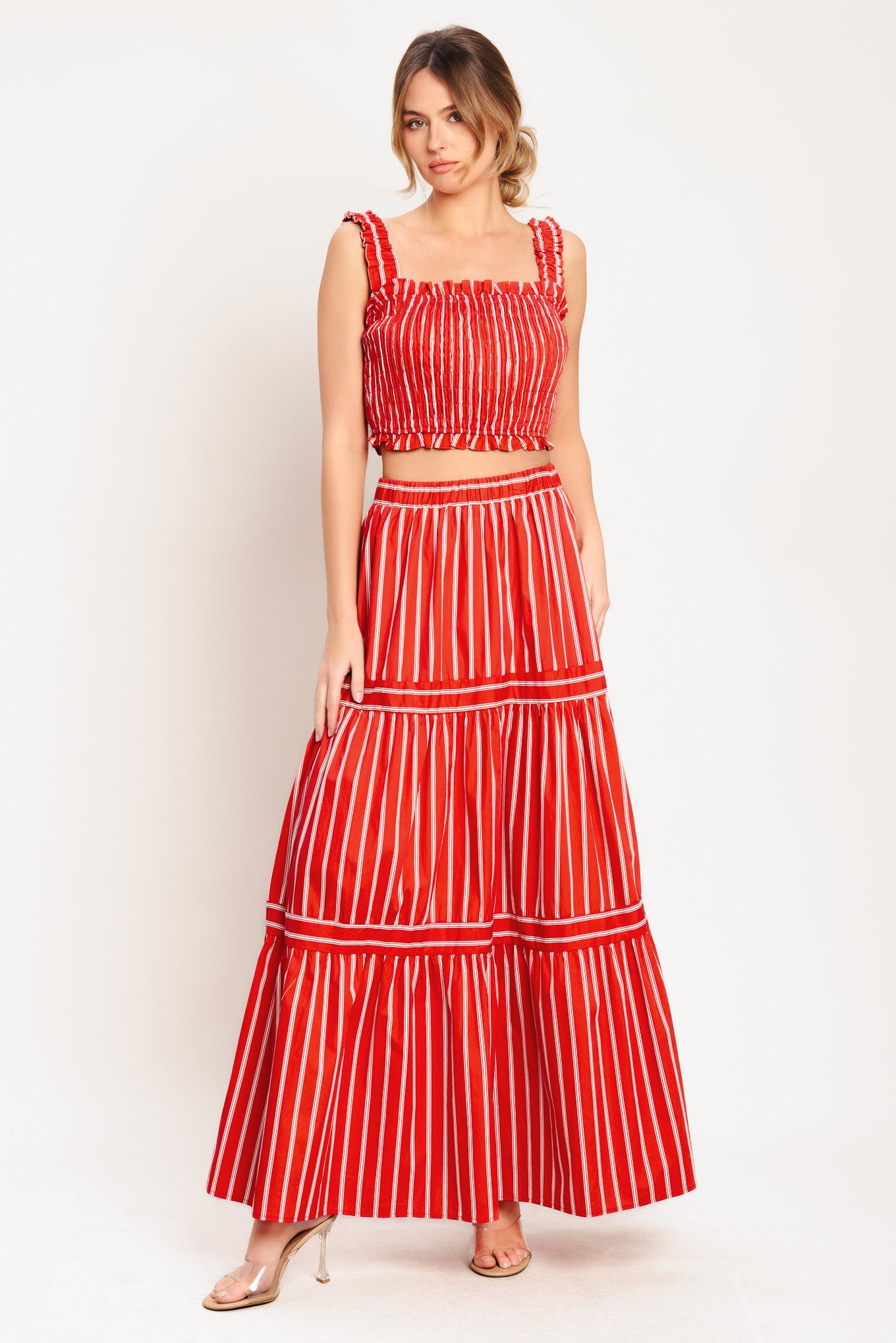 A striped woven top featuring straight ruffled neckline, straps and smocked bodice. Matching skirt IK7744T

Details:

Self: 100% Cotton

Lining: 100% Polyester

Size & Fit

-Model is 5`8" And Wearing Size Small
-Measurements Taken From Size Small
-Approx. Length: 17"