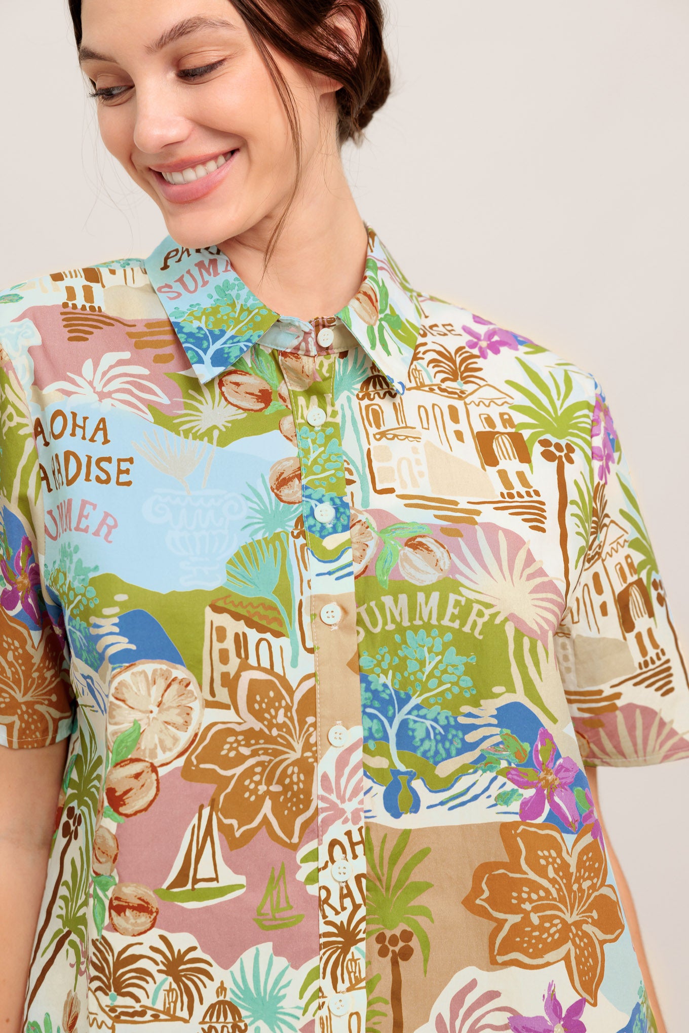 A printed woven top featuring collar, short sleeve and button down closure

Details:

Self: 100% Cotton

Size & Fit

- Model is 5`8" And Wearing Size Small
- Measurements Taken From Size Small