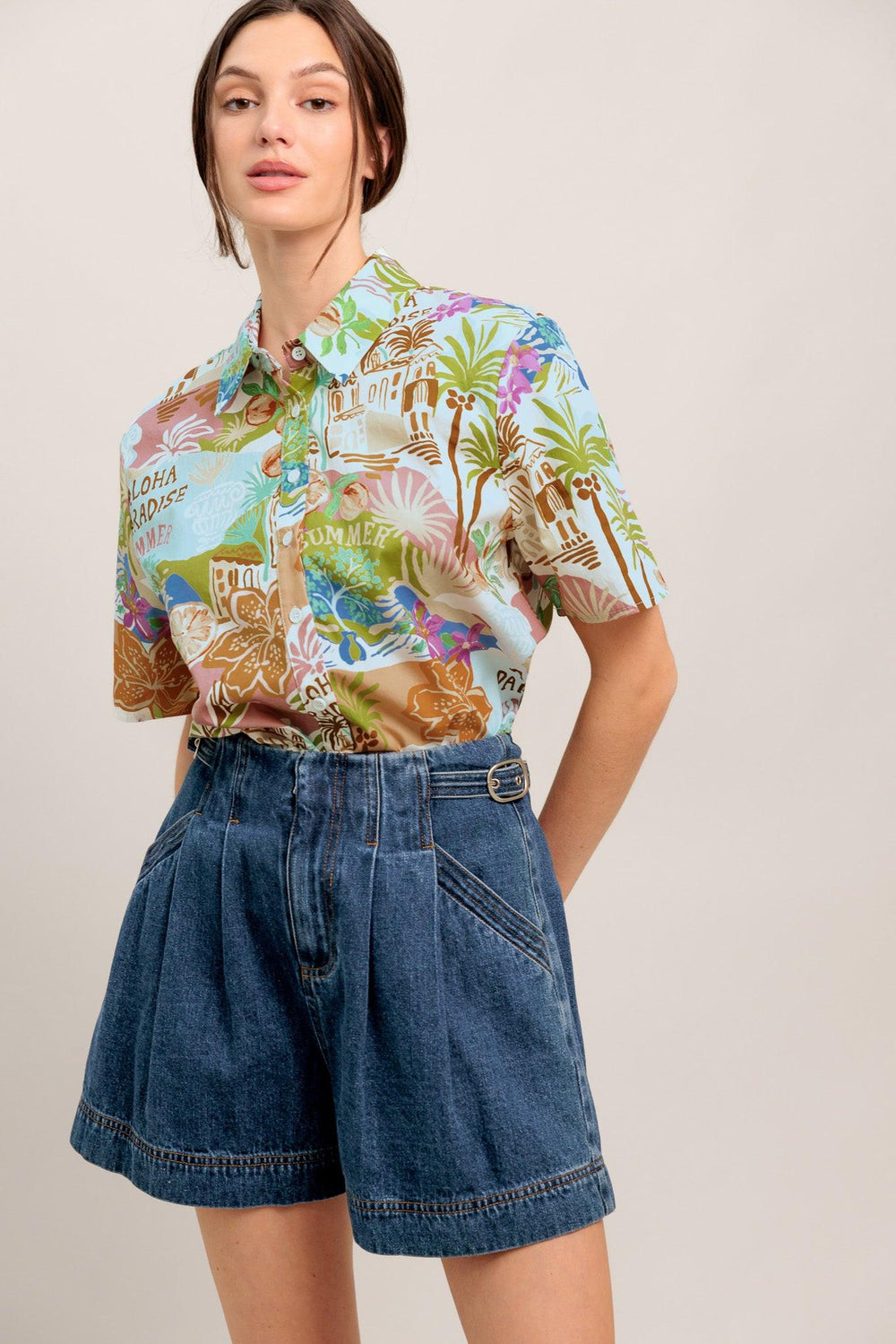 A printed woven top featuring collar, short sleeve and button down closure

Details:

Self: 100% Cotton

Size & Fit

- Model is 5`8" And Wearing Size Small
- Measurements Taken From Size Small